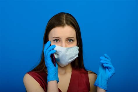 Premium Photo Portrait Of A Girl Wearing A Face Mask On A Blue Background