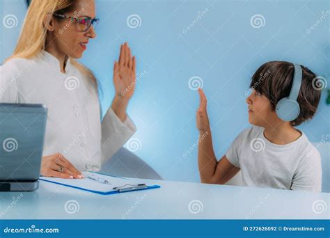 Hearing Test For Children Audiologist Working With A Preschooler Boy