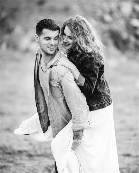 Premium Photo Beautiful Couple On The Background Of A Stone Cliff