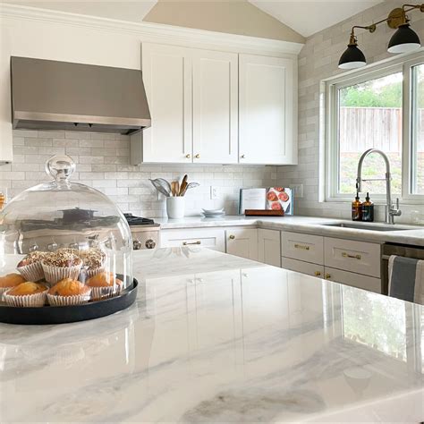 White Modern Traditional Kitchen With White Quartzite Counters And