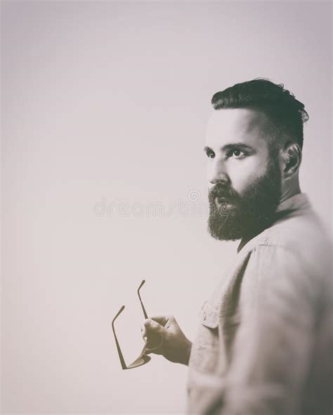 Portrait Of A Bearded Man In A Suit On A Light Background Stock Image