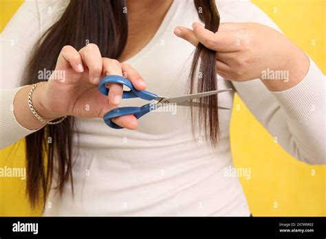 Year Old Latina Woman Suffers From Damaged Hair And Cuts The Split Ends With Scissors