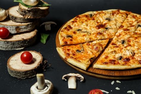 Free Photo | Mushroom pizza with sliced mushrooms and tomato