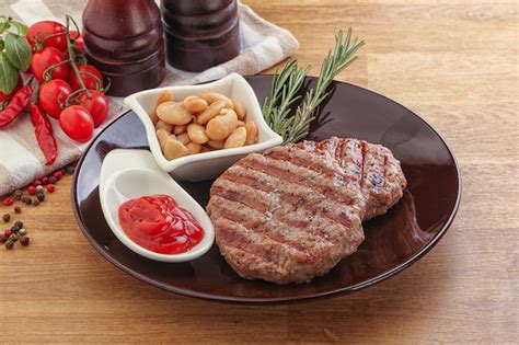 Premium Photo Grilled Beef Burger Cutlet With Sauce And Beans