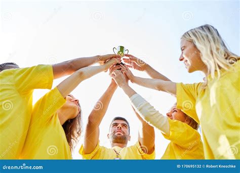 Successful Winner Team with Trophy Stock Photo - Image of teambuilding ...