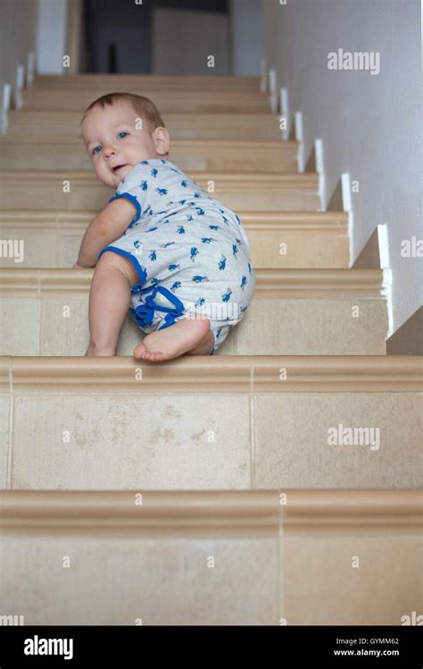 Baby Boy Crawling Up The Stairs Low Angle View Stock Photo Alamy