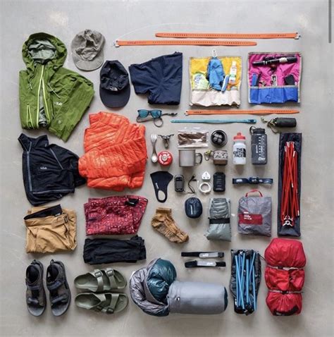 An Assortment Of Clothing And Accessories Laid Out On A Table