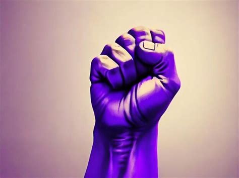 Premium Photo Raised Purple Fist Of A Woman For International