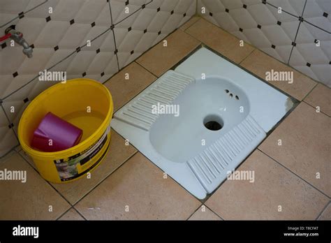 A Traditional Squat Toilet Hole In The Ground In A Petrol Station In