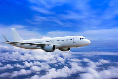 Premium Photo Plane In The Sky Passenger Commercial Plane Flying Above The Clouds Concept Of