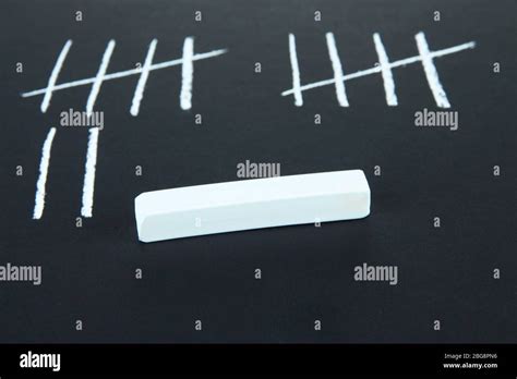 Counting Days By Drawing Sticks Isolated On Black Stock Photo Alamy