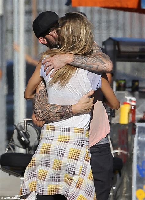 Behati Prinsloo Shares A Tender Kiss With Adam Levine On Set Of Animal