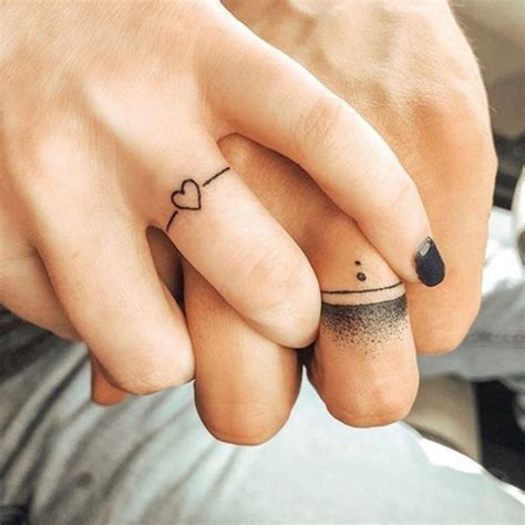 16 Wedding Ring Tattoos We Kind Of Love In 2020 Ring Tattoo Designs