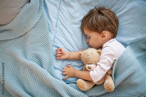 Cute Little Boy Sleeping In Bed At Home Sleeping Baby In Bed Holding