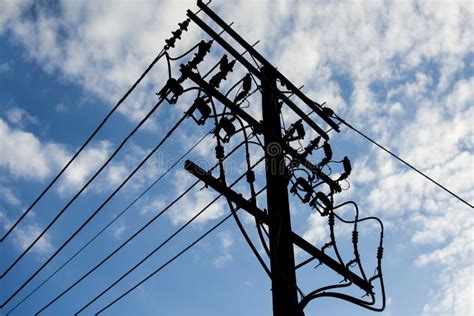 Electric Pole Connect To The High Voltage Electric Wires With Blue Sky