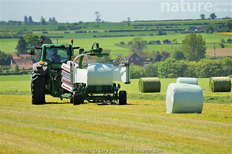 Stock Photo Of Mechanised Haylage Harvesting Tractor With Appliance