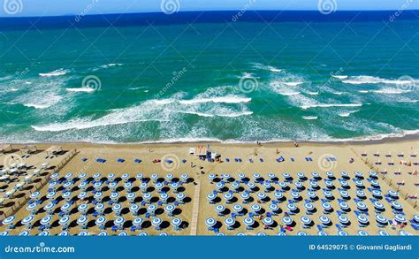 Beautiful Aerial View of Beach Chairs and Umbrellas Along the Ocean ...