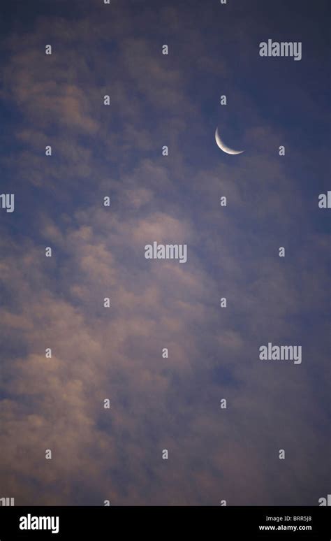 Crescent moon and clouds Stock Photo - Alamy