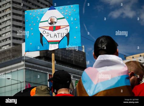 A Participant Of The Warsaw Equality Parade Holds A Placard With The