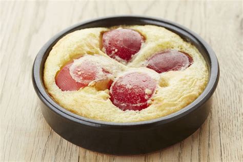 A Pan Filled With Food On Top Of A Wooden Table