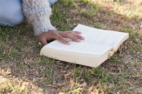 Free Photo Reading With Book On Ground