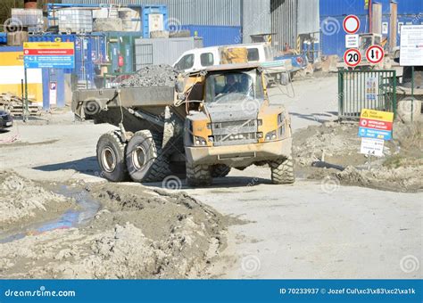 Dirty Heavy Volvo Dumper Loaded By Rock Moving In Work Site. There Is ...