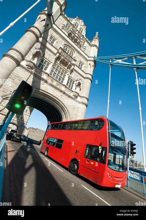 Red London bus on Tower Bridge in London Stock Photo - Alamy