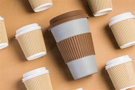 From Above Of Various Disposable Cups Of Hot Drinks Placed On Wooden Table In Cafe Stock Photo