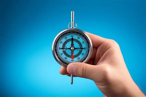 Premium Photo Hand Holding Compass With Needle Pointing The Text