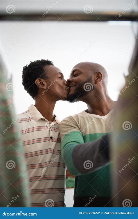 Close Up Of African American Gay Couple Having Fun With Kisses Stock Photo Image Of Clothing