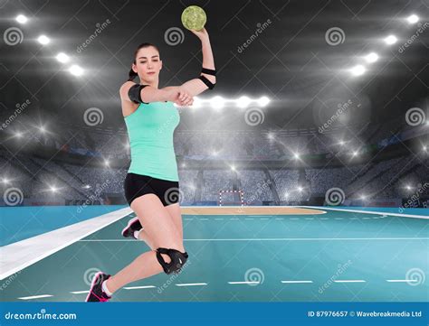 Female Handball Player Throwing Ball At Handball Court Stock Image