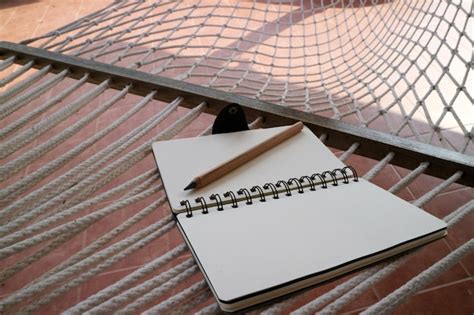 Premium Photo Notebook And Pencil On Hammock