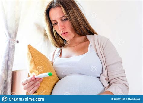 Pregnant Sick Fever Thermometer. Pregnancy Woman Holding Thermometer ...