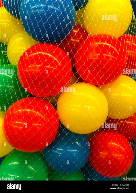 Plastic colored balls in grid. Studio Photo Stock Photo - Alamy