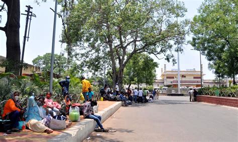 Inter-state passengers wait at Nampally railway station