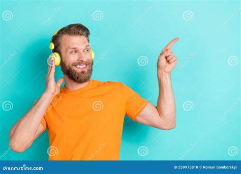 Portrait Of Good Mood Guy With Blond Hairdo Wear Orange T Shirt Fingers