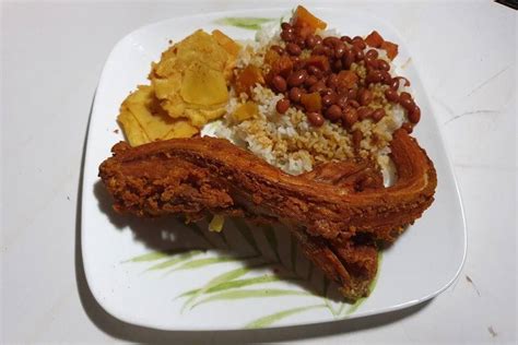 Iguana Frita Con Tostones De Pana Sabrosia Puerto Rico