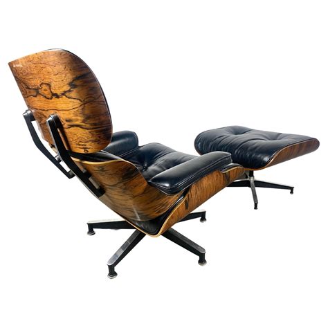 Charles Eames Lounge Chair And Its Black Leather And Rosewood Ottoman