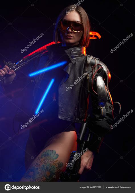 Sexy Female Killer With Nude And Tattooed Leg In Dark Background Stock