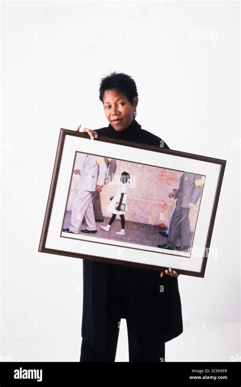 Ruby Bridges Holding A Print Of The Norman Rockwell Painting The