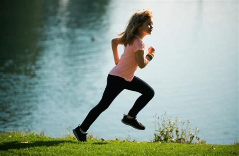 premium photo kid runners  park sporty young child jogging