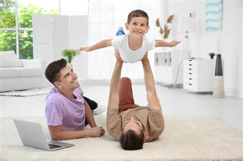 Premium Photo Male Gay Couple Playing With Foster Son Adoption Concept