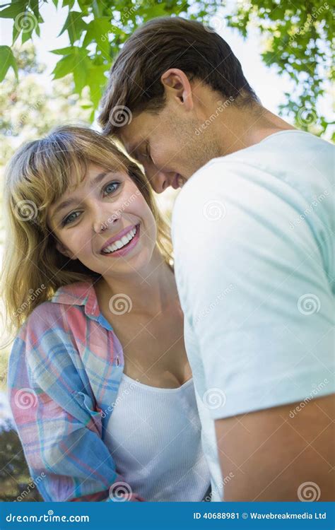 Pretty Blonde Smiling While Hugging Boyfriend In The Park Stock Image Image Of Handsome