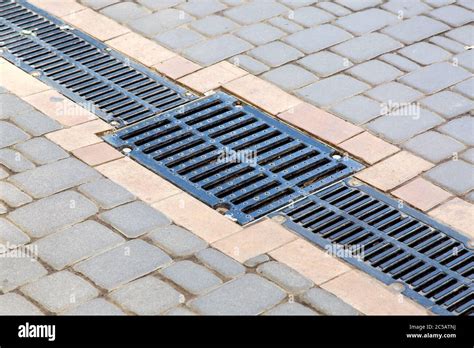 A Lattice Of A Drainage Paving System With Hatch Grill On A Path Made