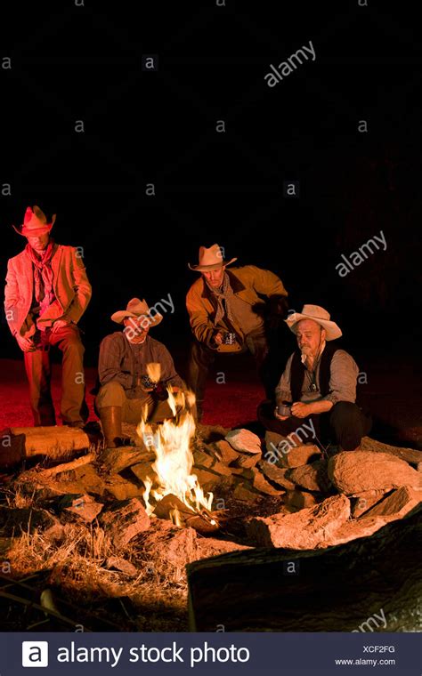 Cowboys Sitting Around Campfire Night High Resolution Stock Photography