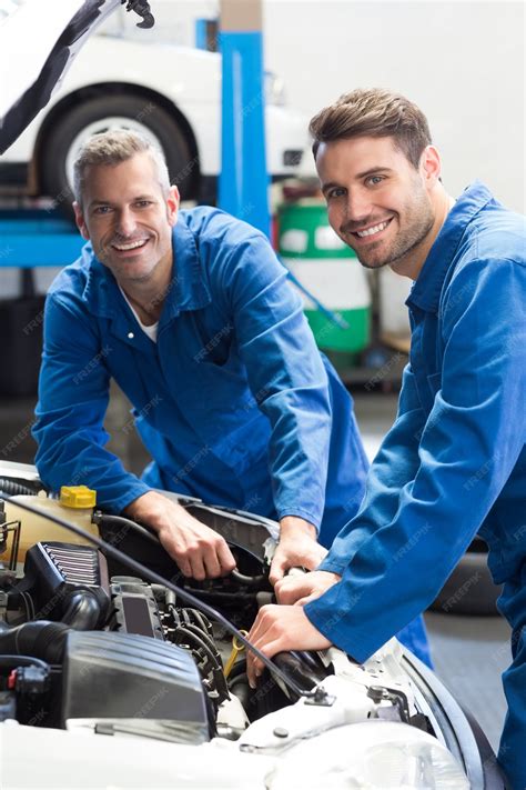 Premium Photo | Team of mechanics working together