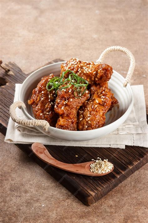 Premium Photo Korean Fried Chicken Yangnyeom Tongdak With Spicy Sauce And Sesame Seed Sayap