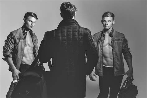 Premium Photo Men Or Photographer With Naked Torso And Sexy Body Holds Photo Camera And Bags