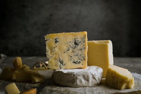 Premium Photo | Various types of soft and hard cheeses