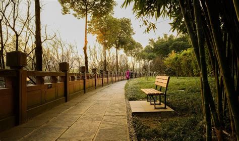 Stone Path Along Balustraded Riverside In City At Twilight Editorial